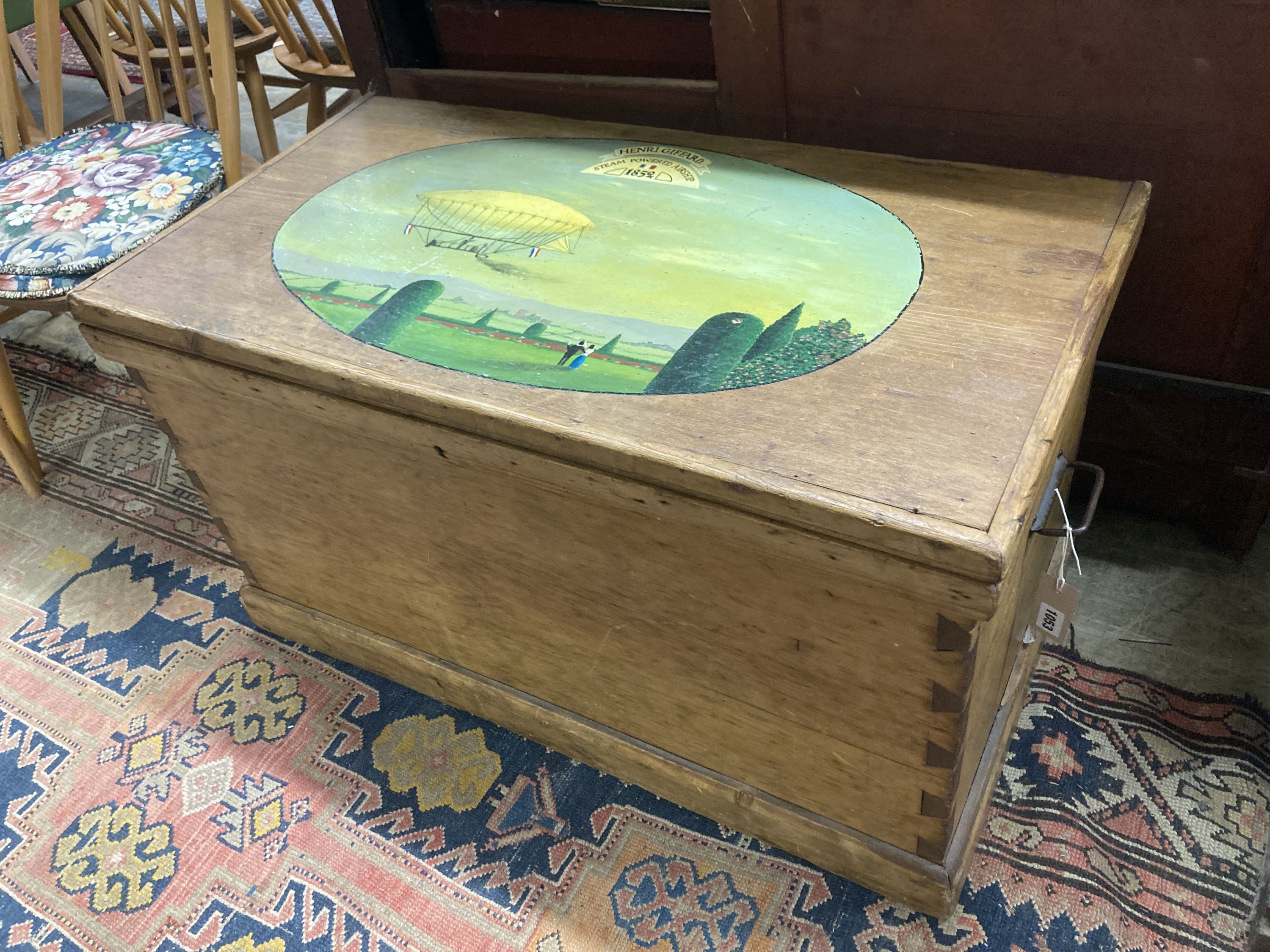 A Victorian stripped pine trunk, the top later painted with an airship scene, length 89cm, depth 37cm, height 50cm